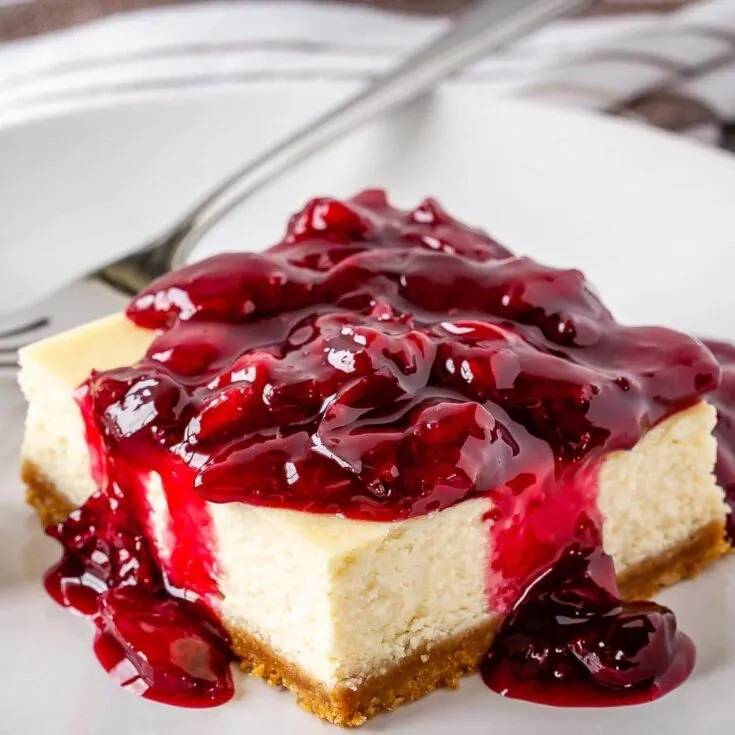 These easy cherry cheesecake bars make the perfect summer dessert - decadent cheesecake topped with a fresh cherry sauce!